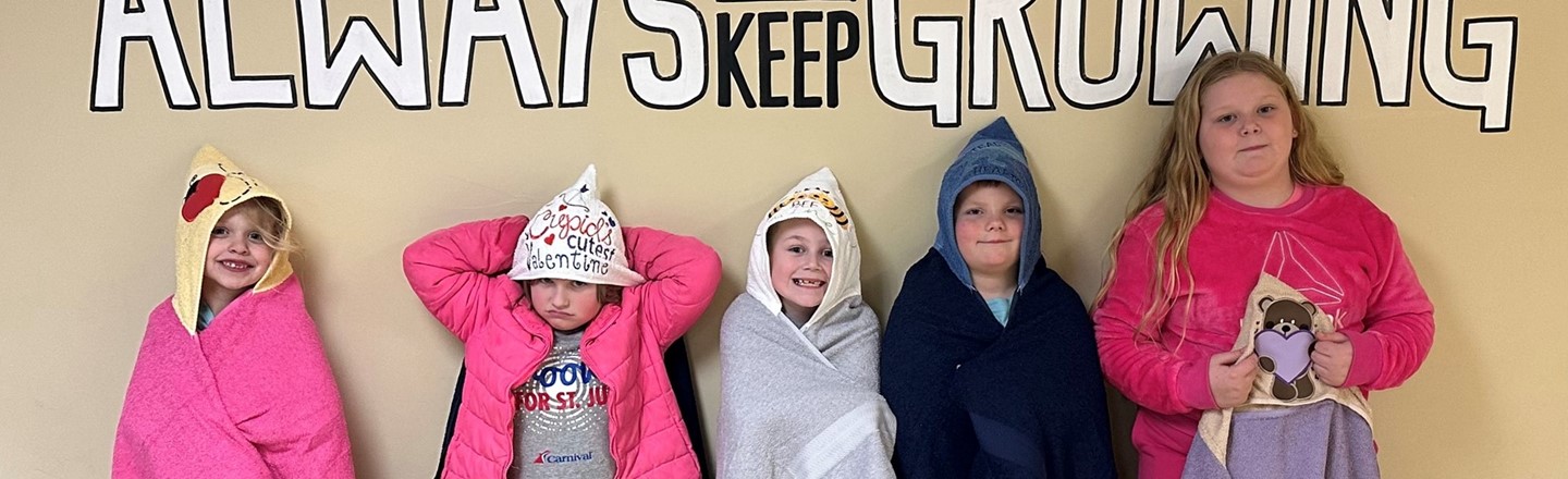 students wrapped in towels