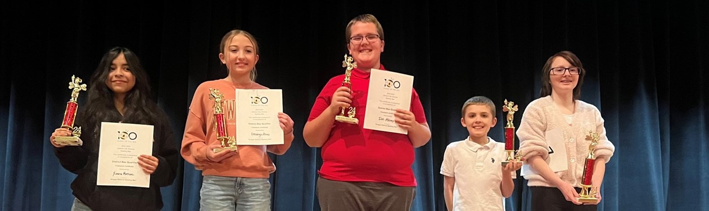 spelling bee winners with trophies