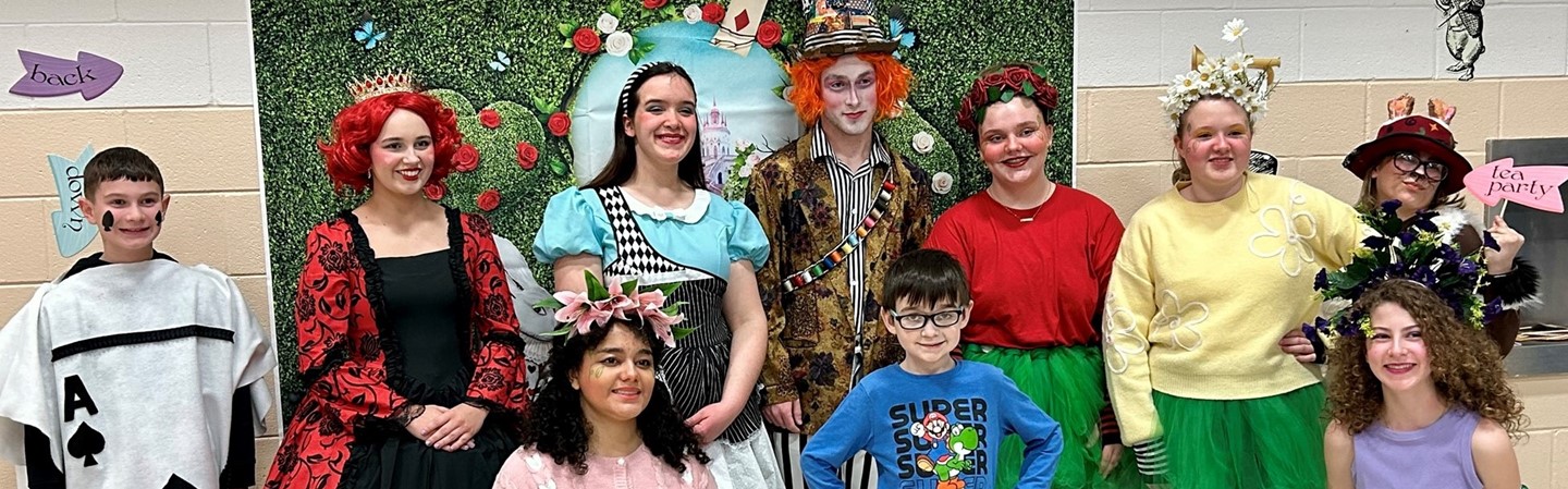 students dressed in Mad Hatter Tea Party costumes